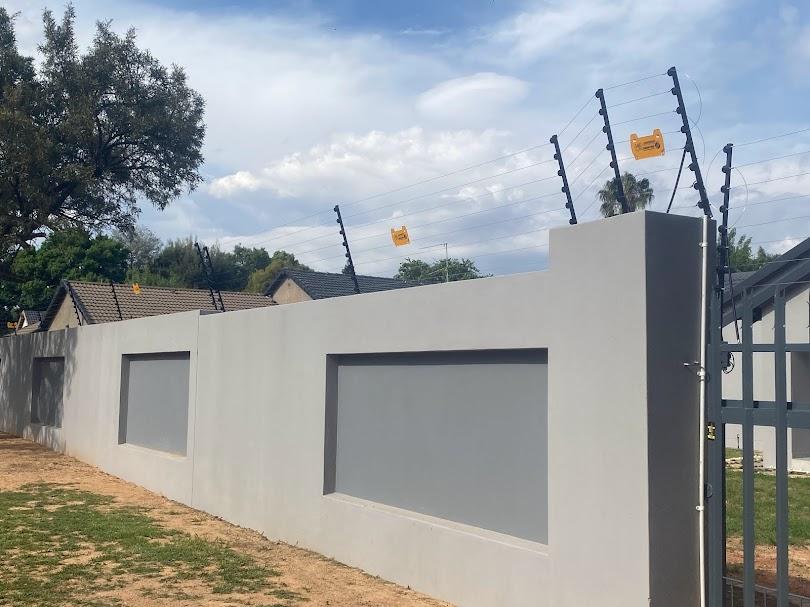 New electric fence installed on a residential boundary wall in Alberton